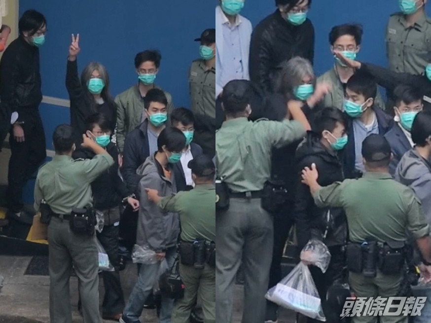 長毛高舉勝利手勢時被懲教職員喝止。