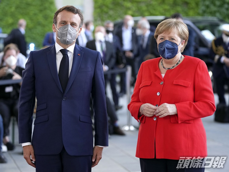 默克爾和馬克龍同呼籲歐盟國家要謹慎防範新冠變種病毒。AP