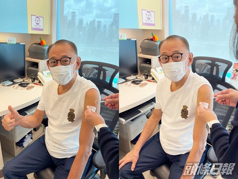 楊受成接種疫苗。