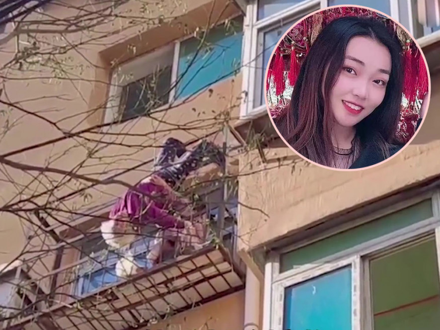 老婦意外墮樓倒掛防盜欄,女子捱冷緊抱半小時,消防終救起老婦。